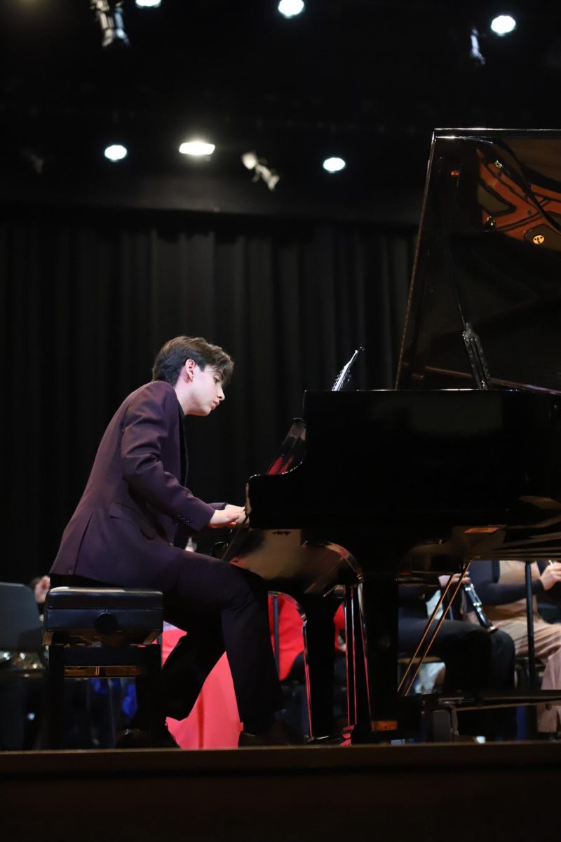 All eyes on him, senior Sam Suarez plays is solo piece on the piano on April 25.