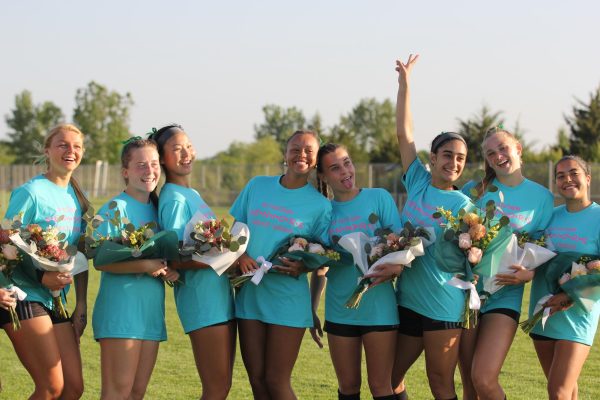 The girls pose for a photo after getting recognized on May 8.