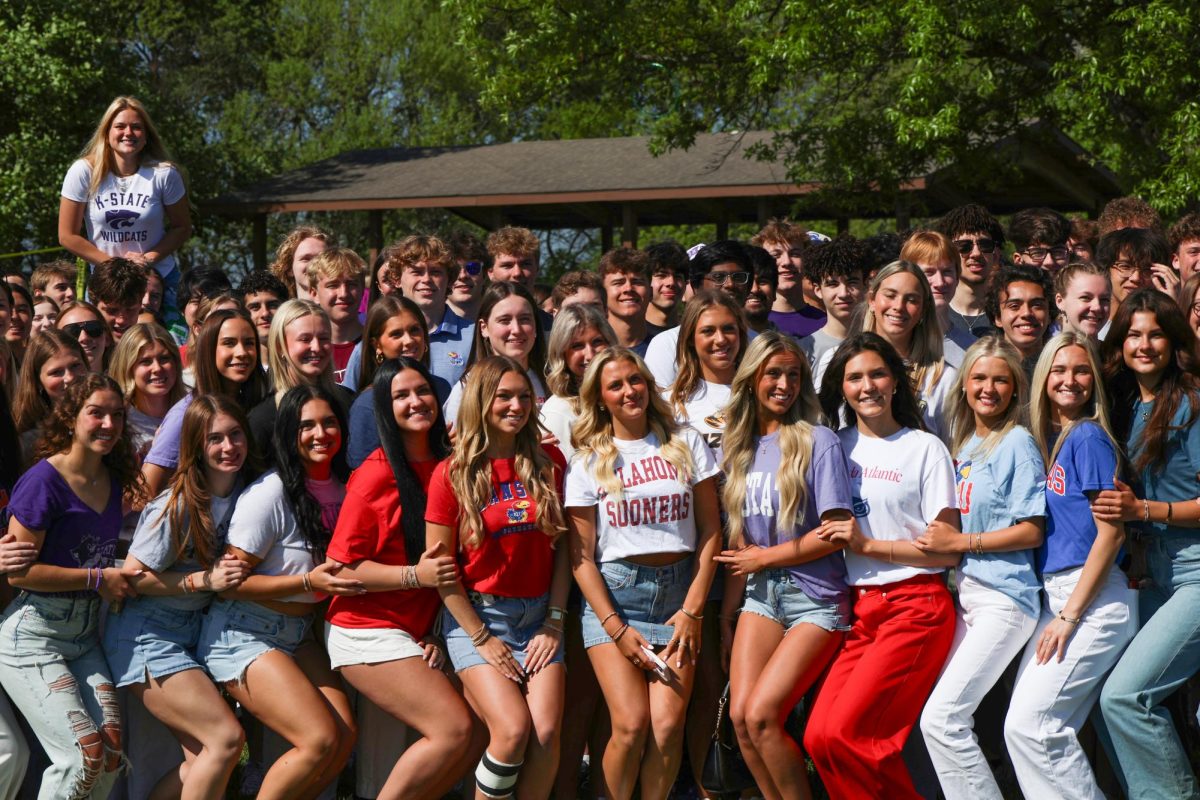Smiles on faces, 2025 senior graduates pose for one last photo together at the senior picnic on May 9.