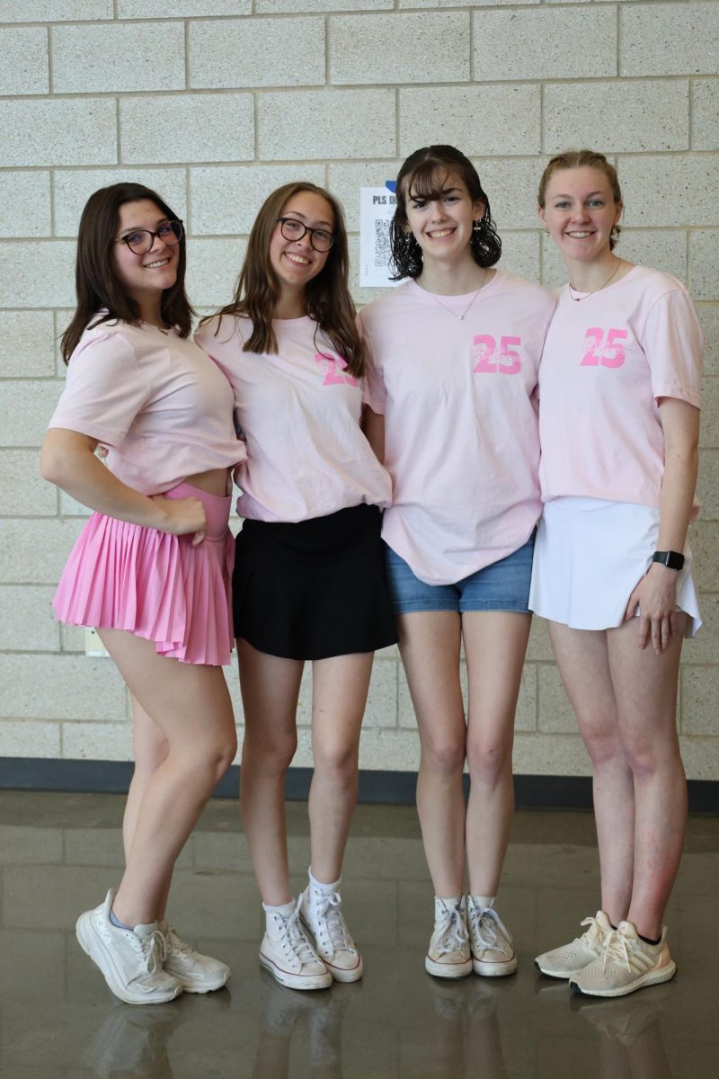 Arms around each other, 2025 yearbook editors smile for a picture to cherish their last memories together at yearbook distribution day on May 9.