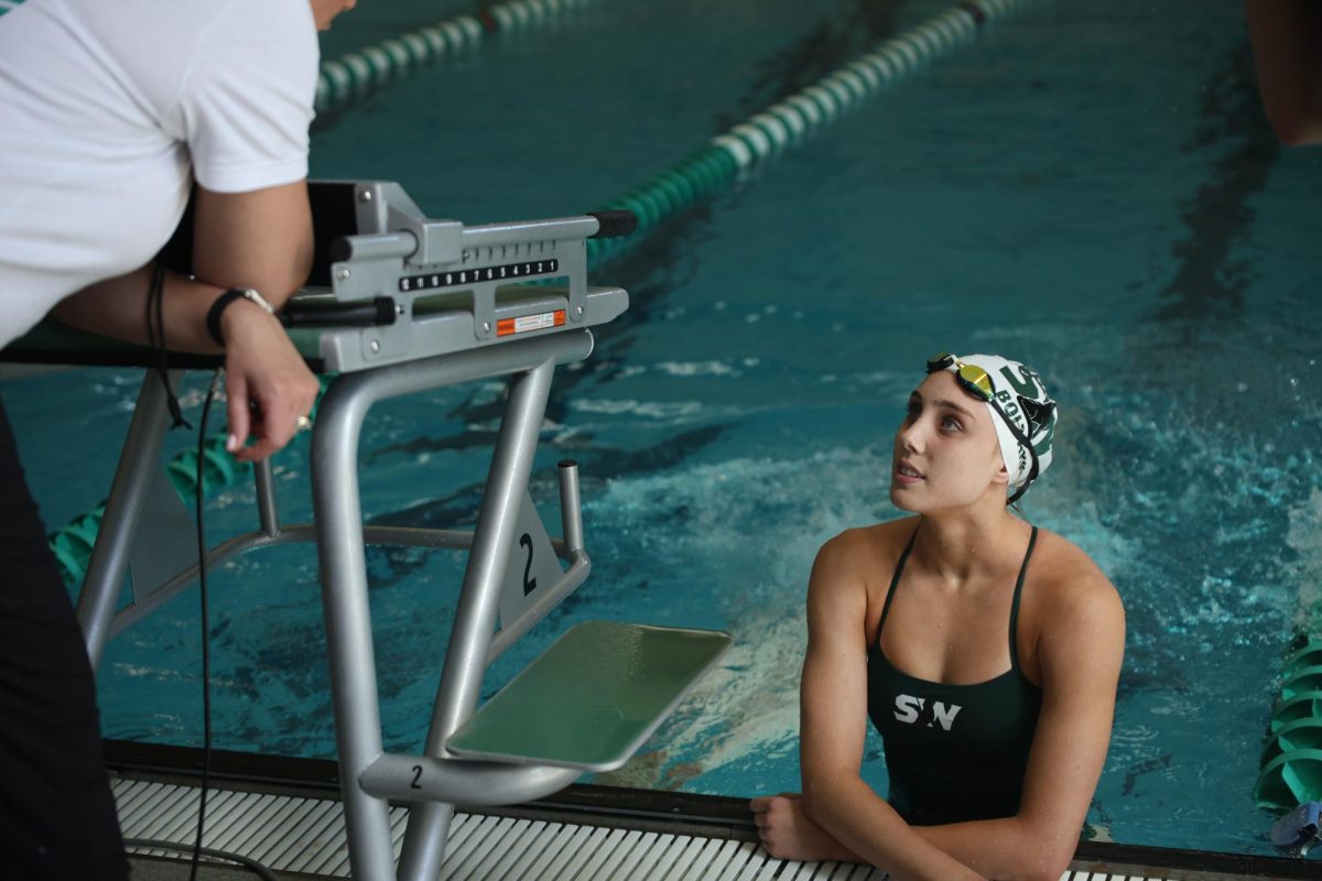 Sophomore Ashlyn Bolyard talks with her mom after the race