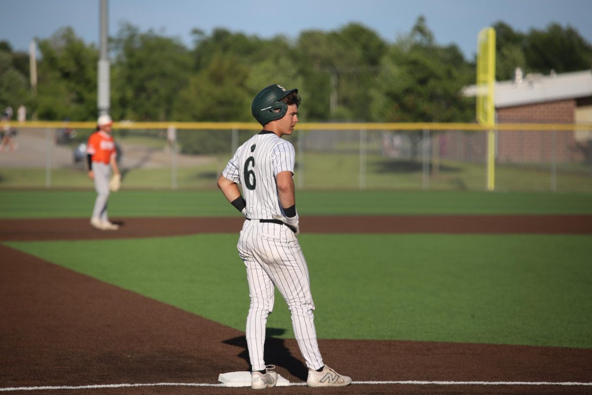 Senior Max Flowers waits on third base in the game against Bonner Springs on May 15. 
