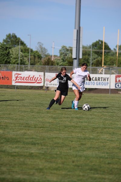 Sophomore Halle Challis tries to steal the ball from the other team.