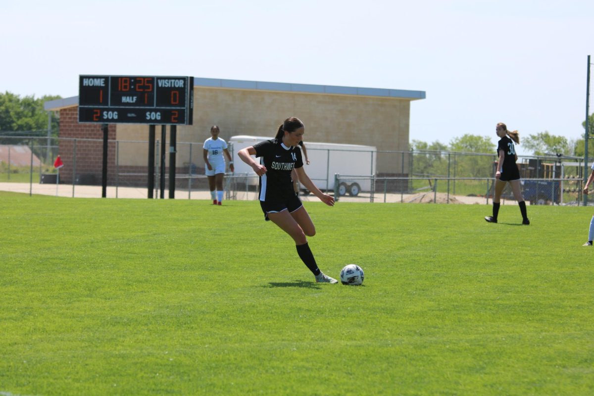Mid kick, sophomore Lily Haskins gets ready to kick the ball on May 10.