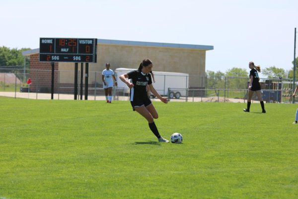 Mid kick, sophomore Lily Haskins gets ready to kick the ball on May 10.