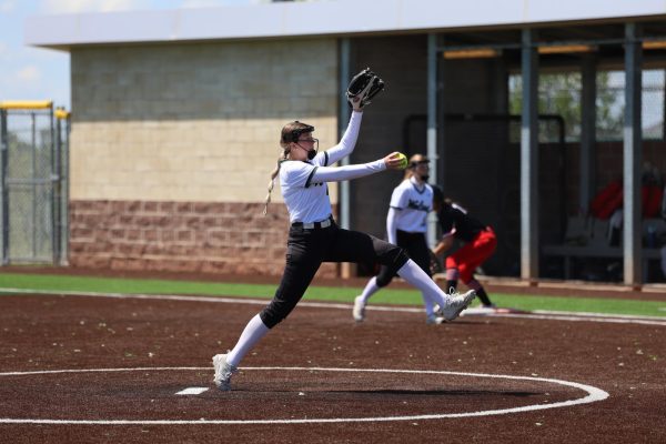 On May 3, junior Addison Jones pitches during the softball game vs Shawnee Mission North. 