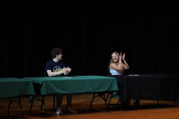 Senior Mia LeFevre and Cameron Hargrove applaud together
