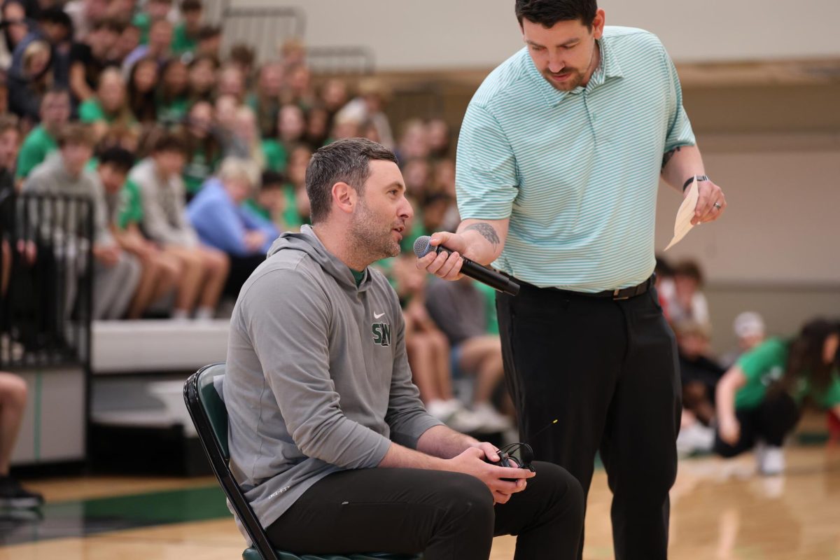 Principal Dr. Alexander participates in the staff skit and chant. 