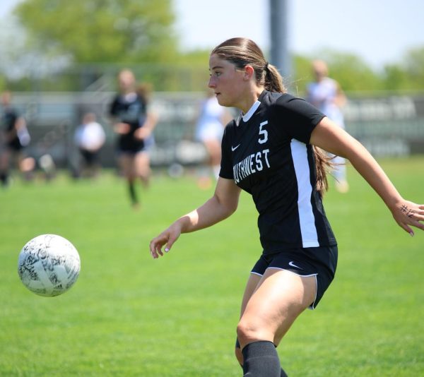 Senior Megan Jackson makes her way down the field keeping control of the ball.