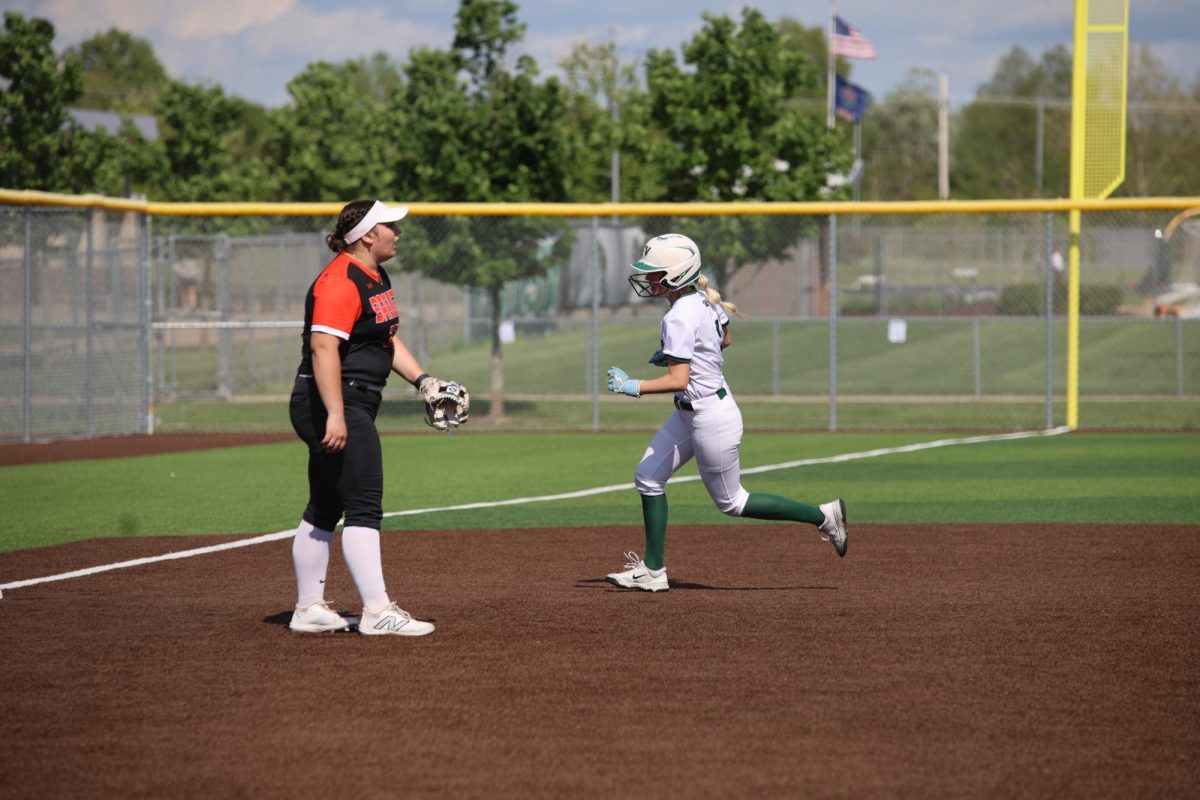 Junior Melia Peters runs to third base. 