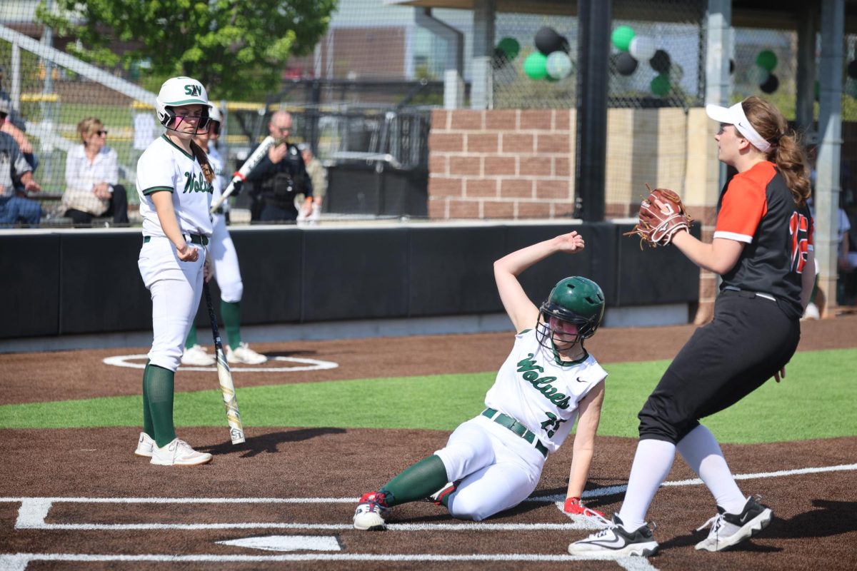 Freshman Ruby Rolling slides into home base. 
