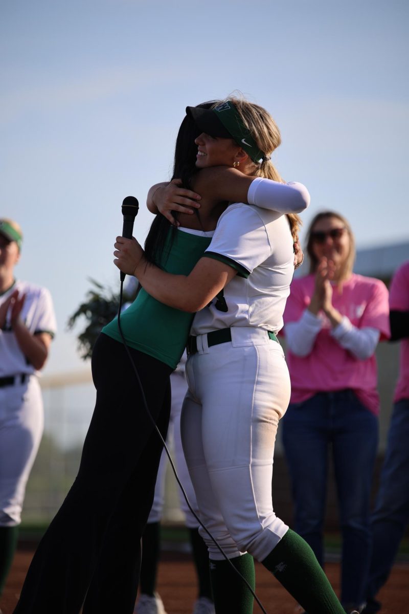 Seniors Sami Tolliver and Karter Skillman hug.