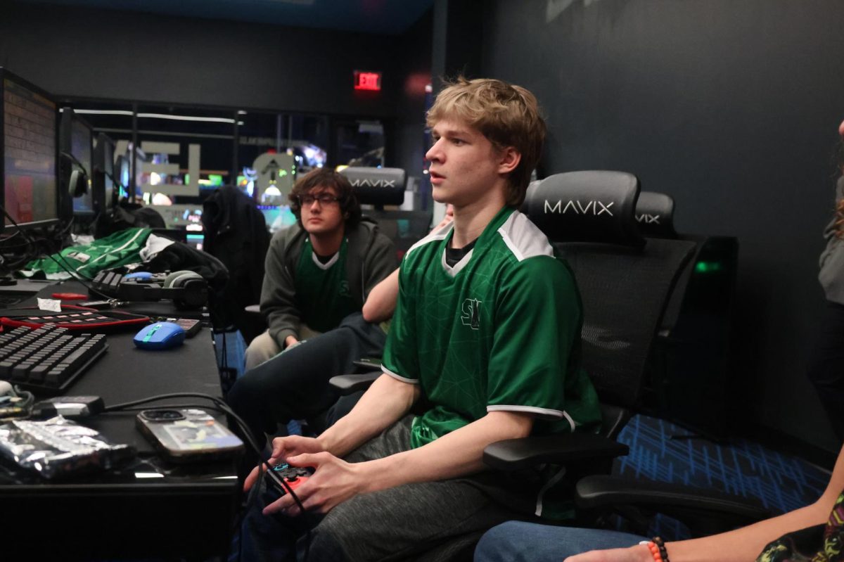 Locked in, junior Rylan Riley looks at the computer as he competes against his opponent during the esports tourney on Jan. 14.