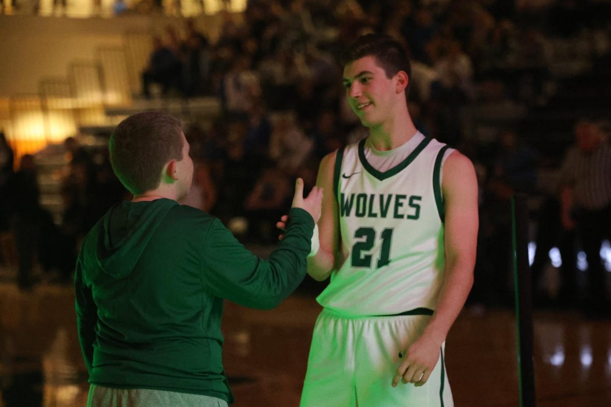 Managers discuss supporting the boys basketball team