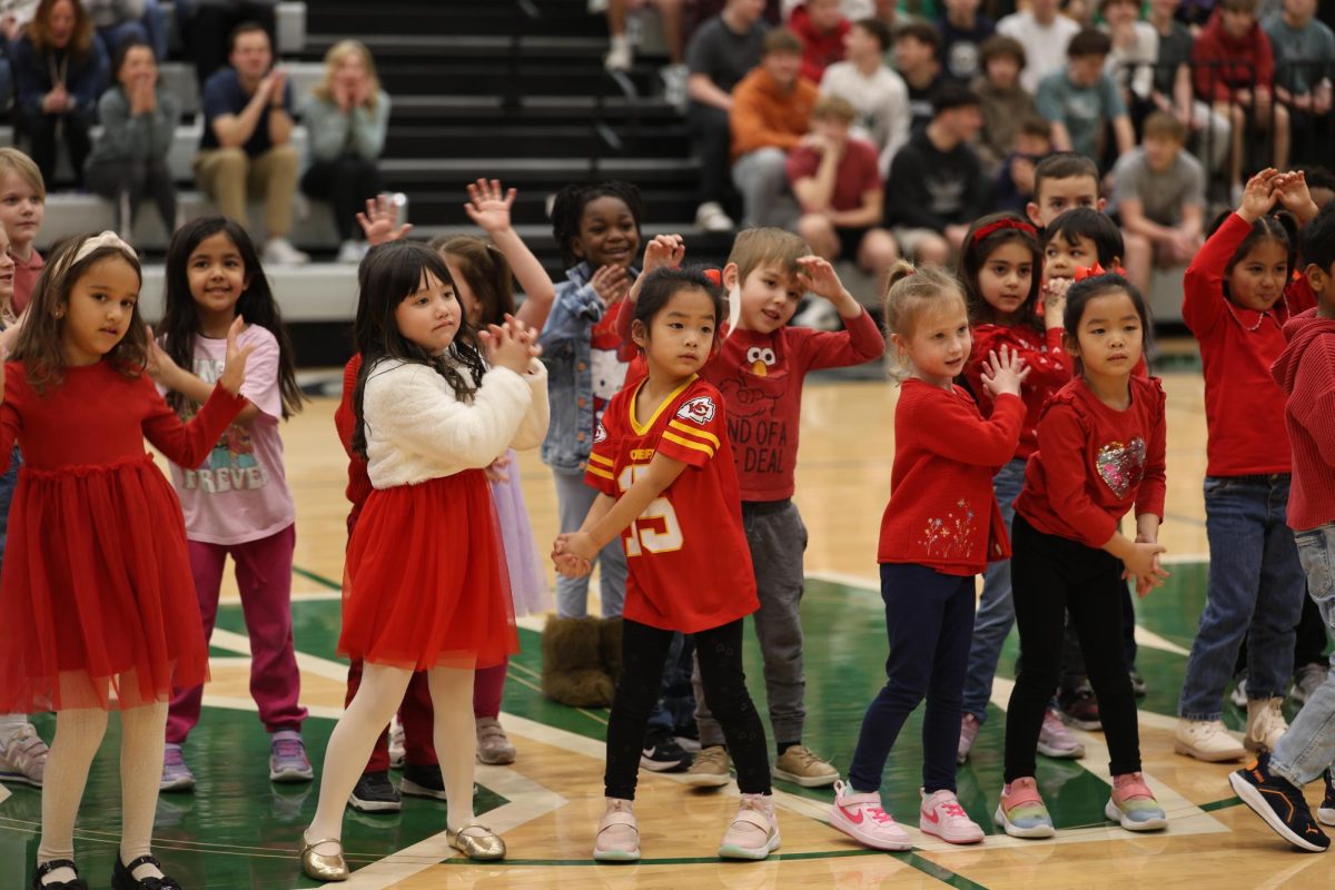 Mid-dance, the Chinese Immersion students from Wolf Springs perform at the diversity assembly on Feb. 26.