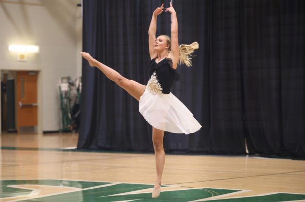 Locked in, senior Elizabeth Kopmeyer turns during her senior solo on April 3 at the Glitter Girls Spring Show.