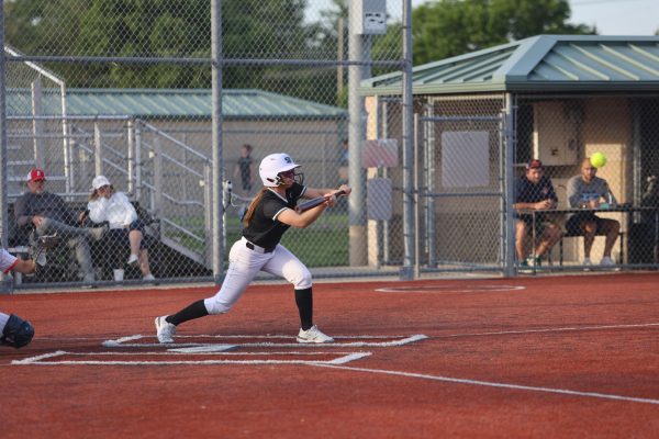 Fake out, freshman Matti Hardy hits a bunt.