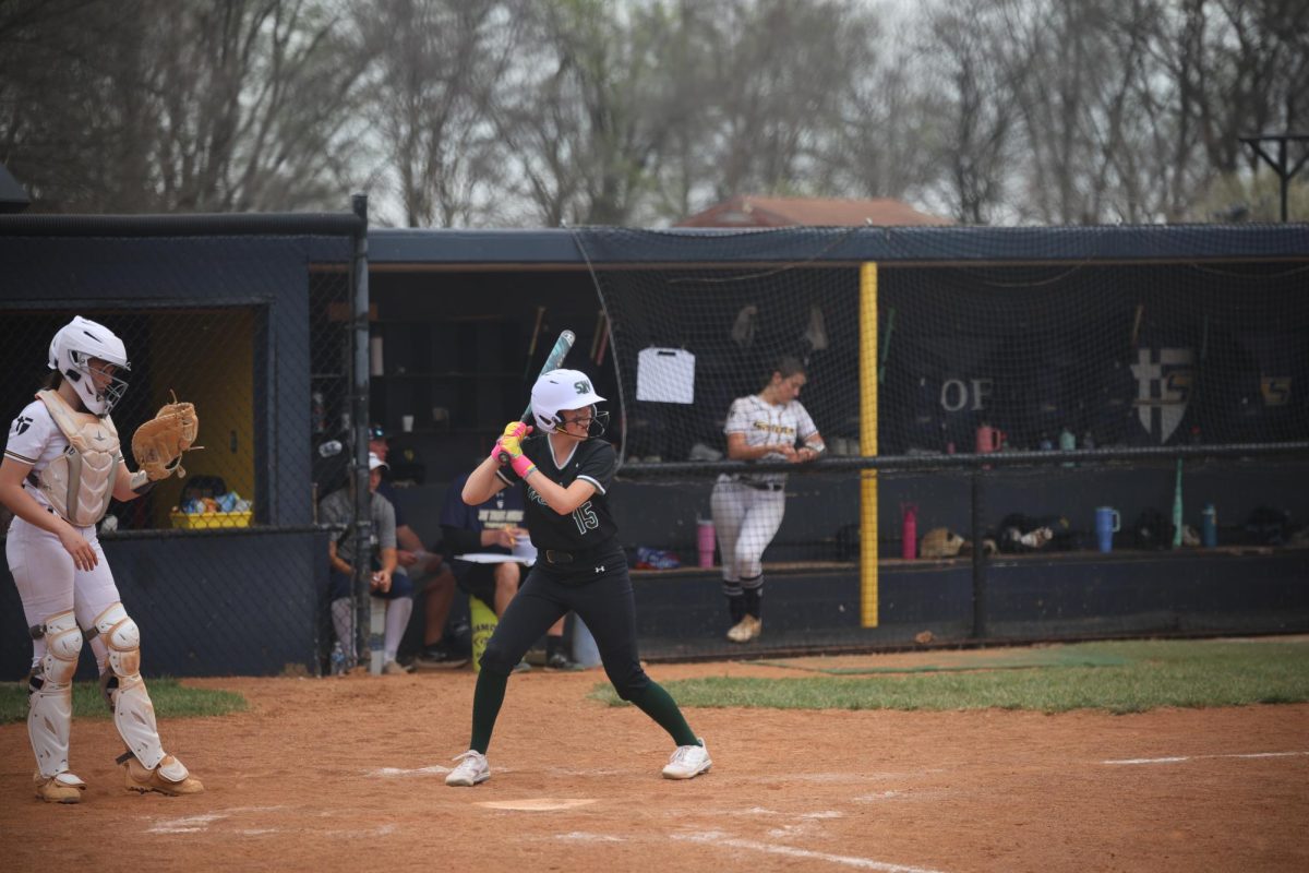 Eyes on the ball, sophomore Hazel Dillavou sets up to bat.