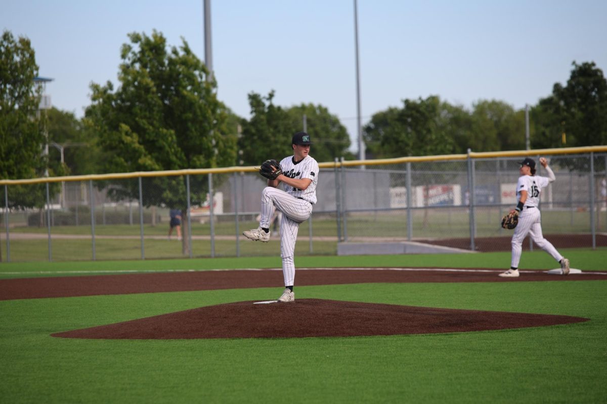 Leg up, senior Gathen Shaner begins his pitching motion on May 7. 